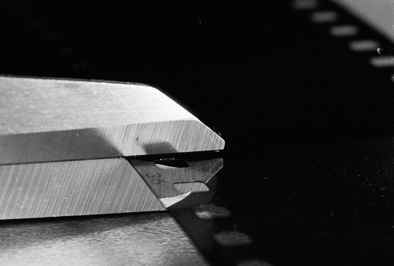 Scissors about to cut a strip of film at frame 36.